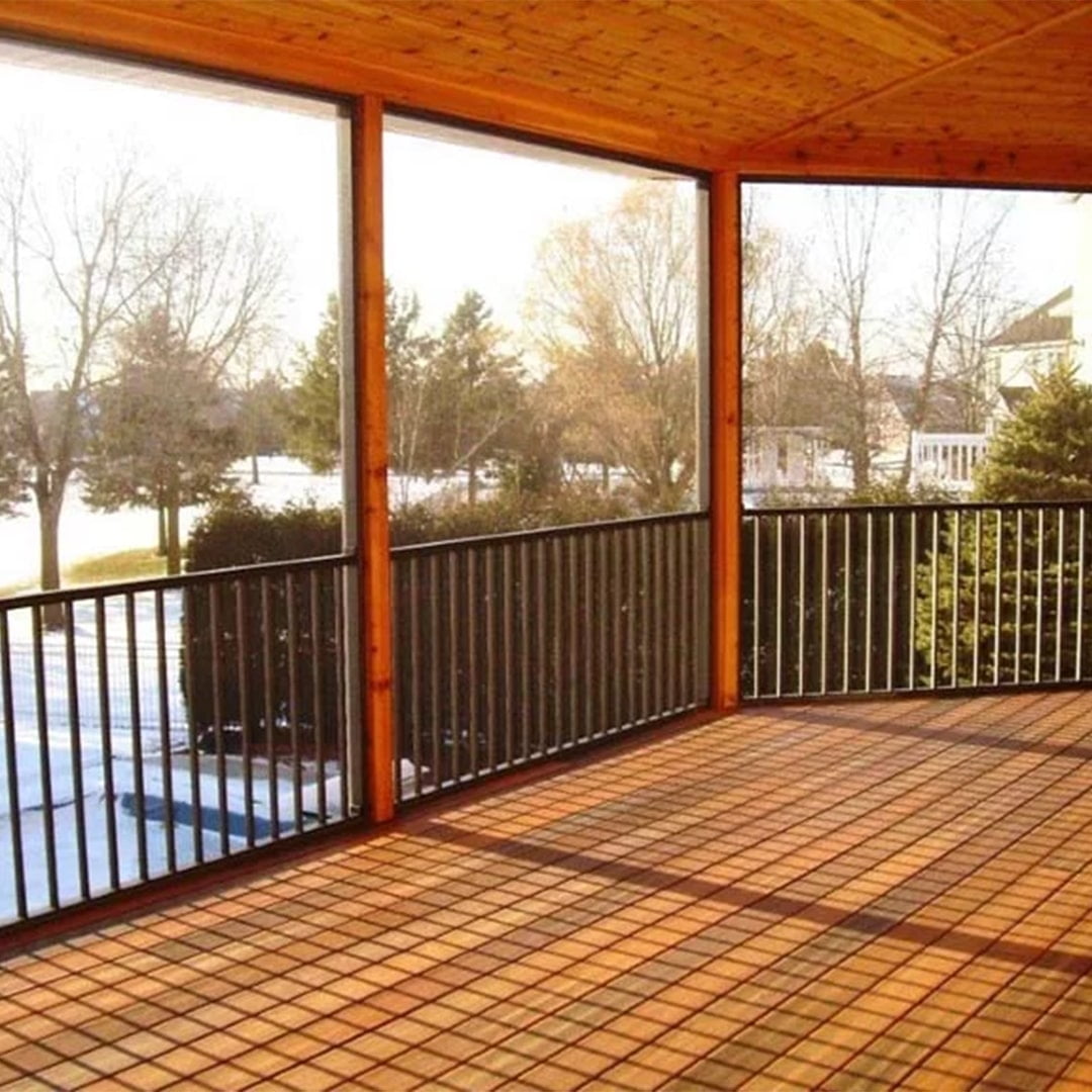 wood deck overlooking backyard has black screen enclosure system running along deck perimeter