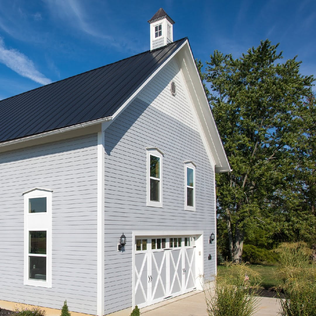 barn style garage doors on farmhouse