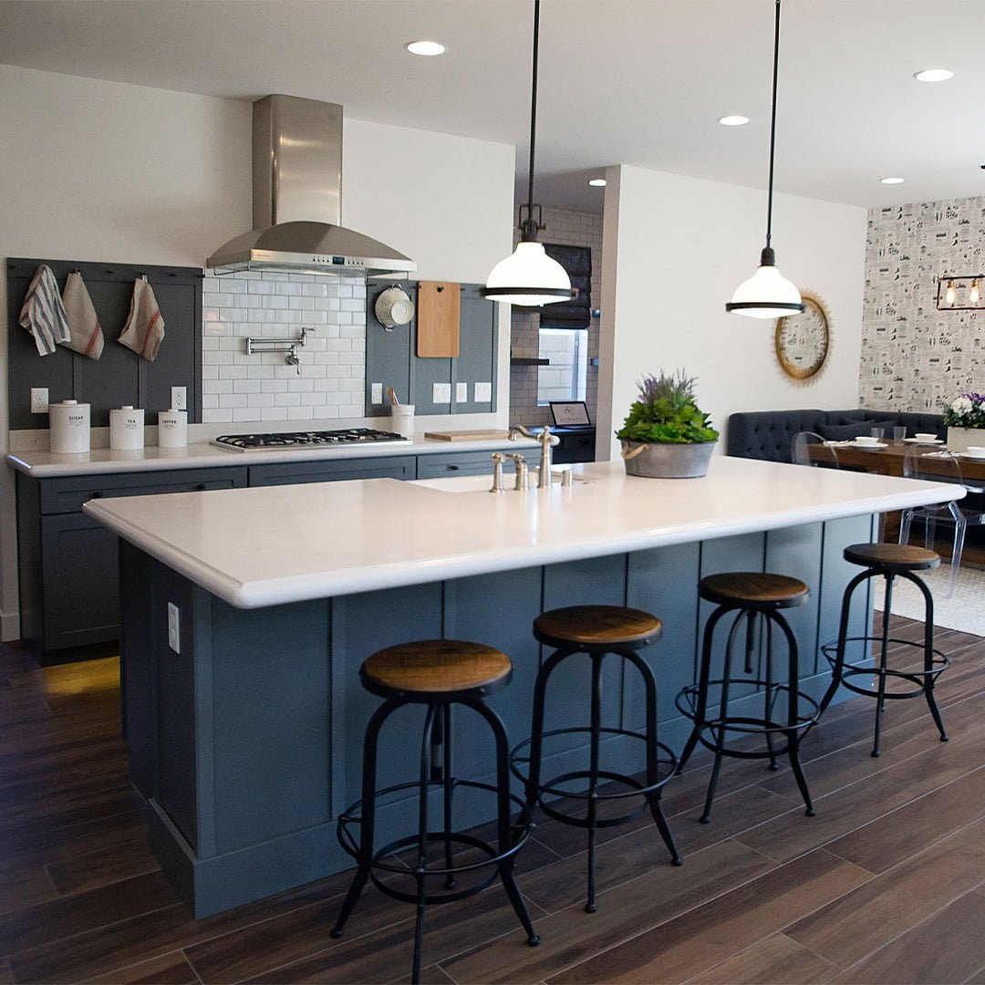 modern kitchen with blue cabinets and white countertops