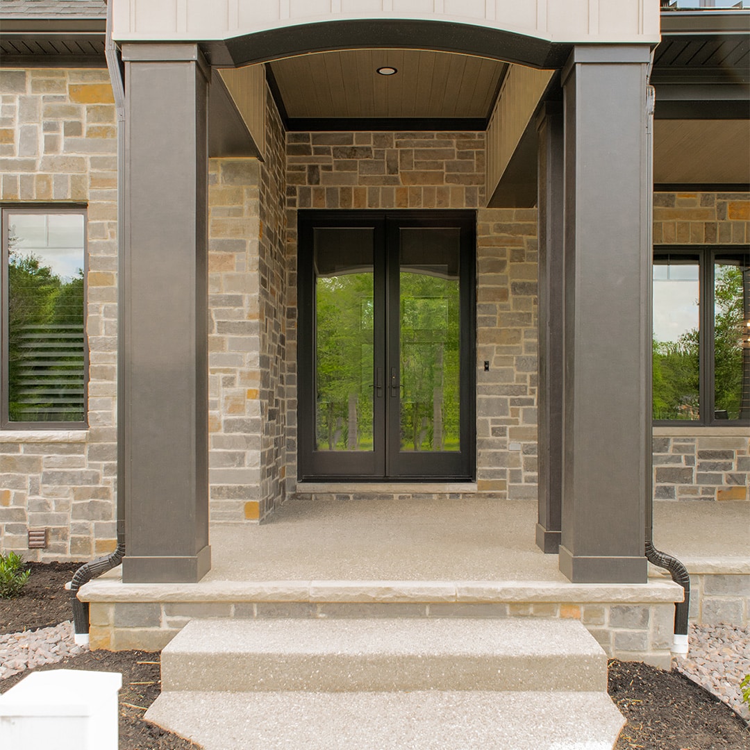 black french doors on expansive front porch