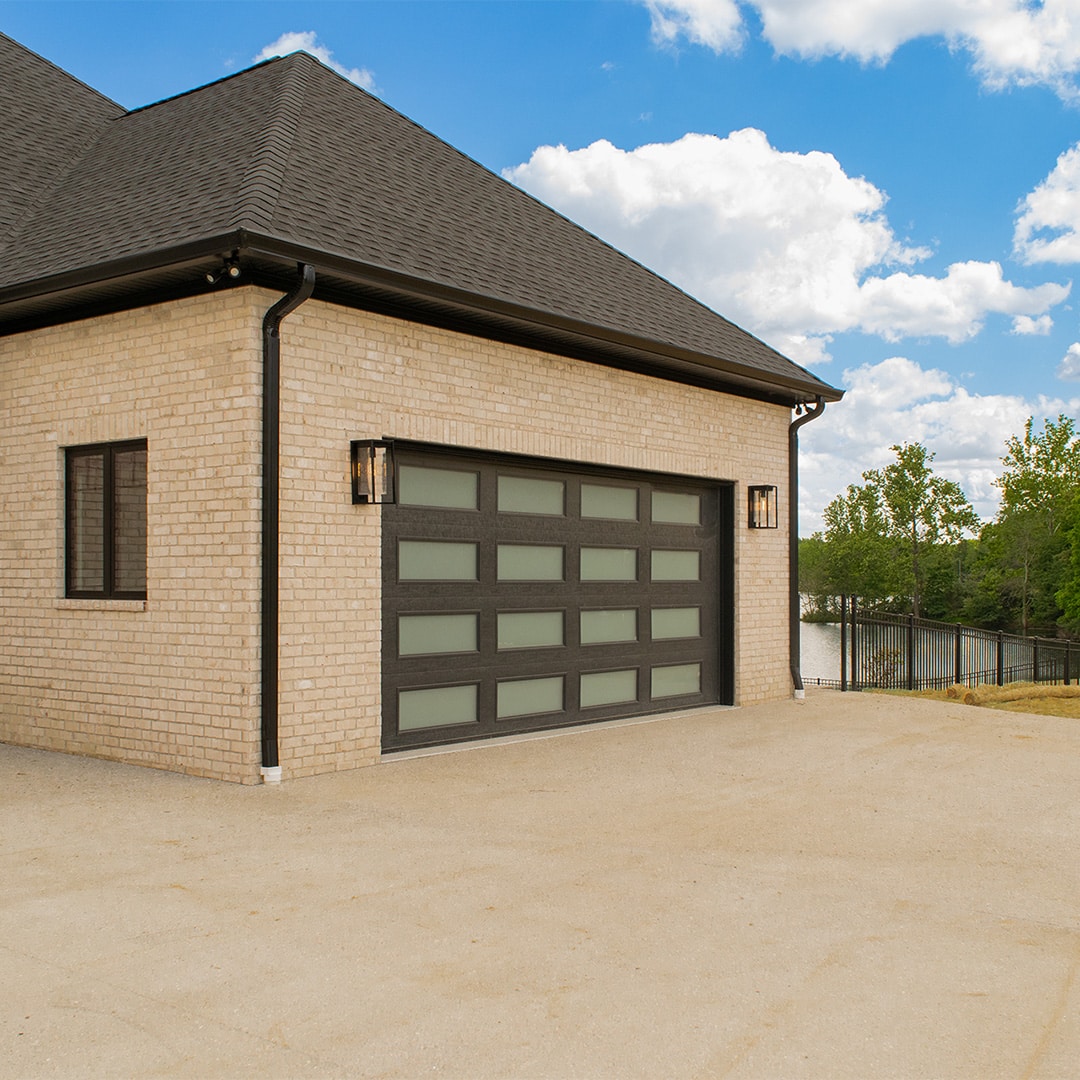 carriage house style garage door on brick home