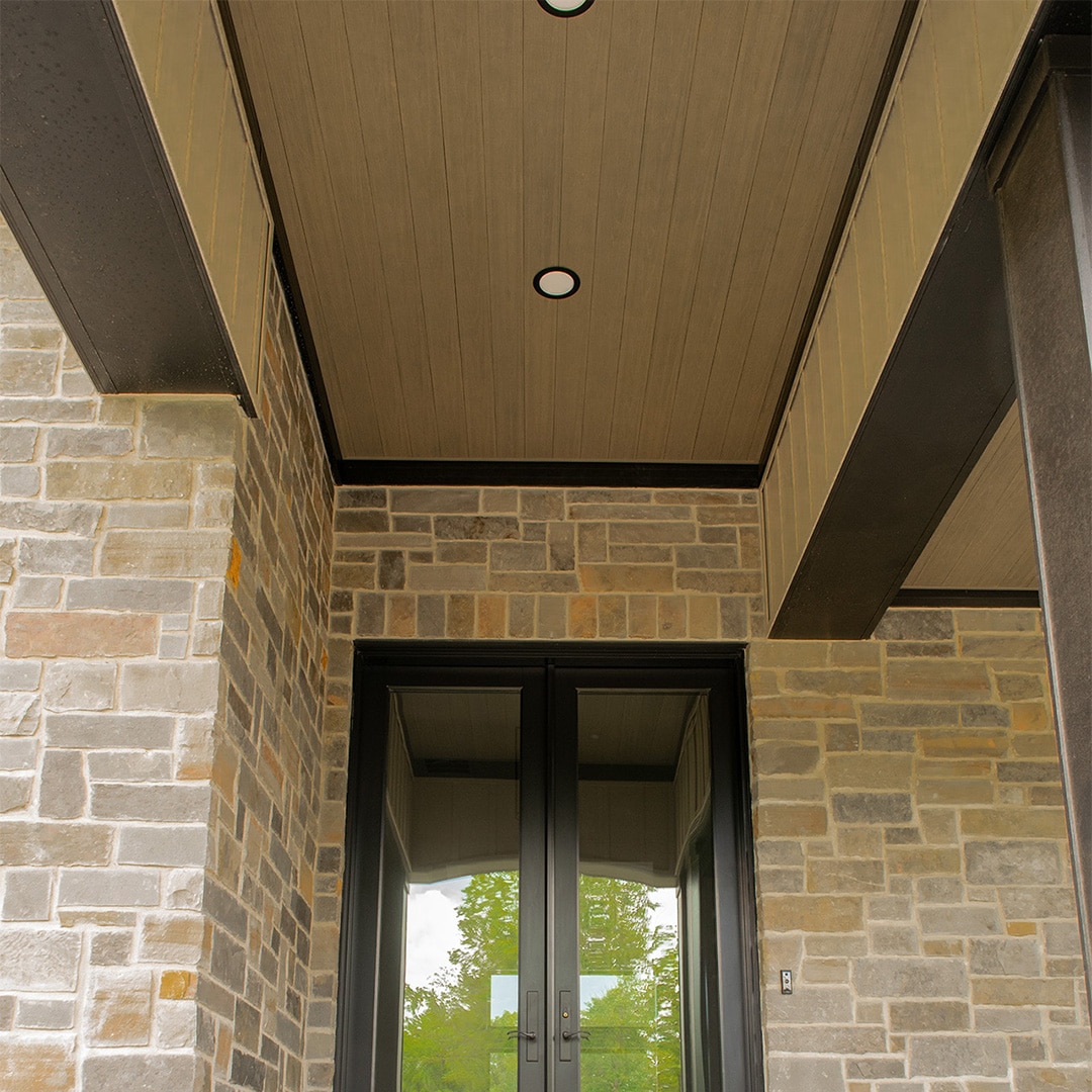 light brown composite wood ceiling planks on front porch