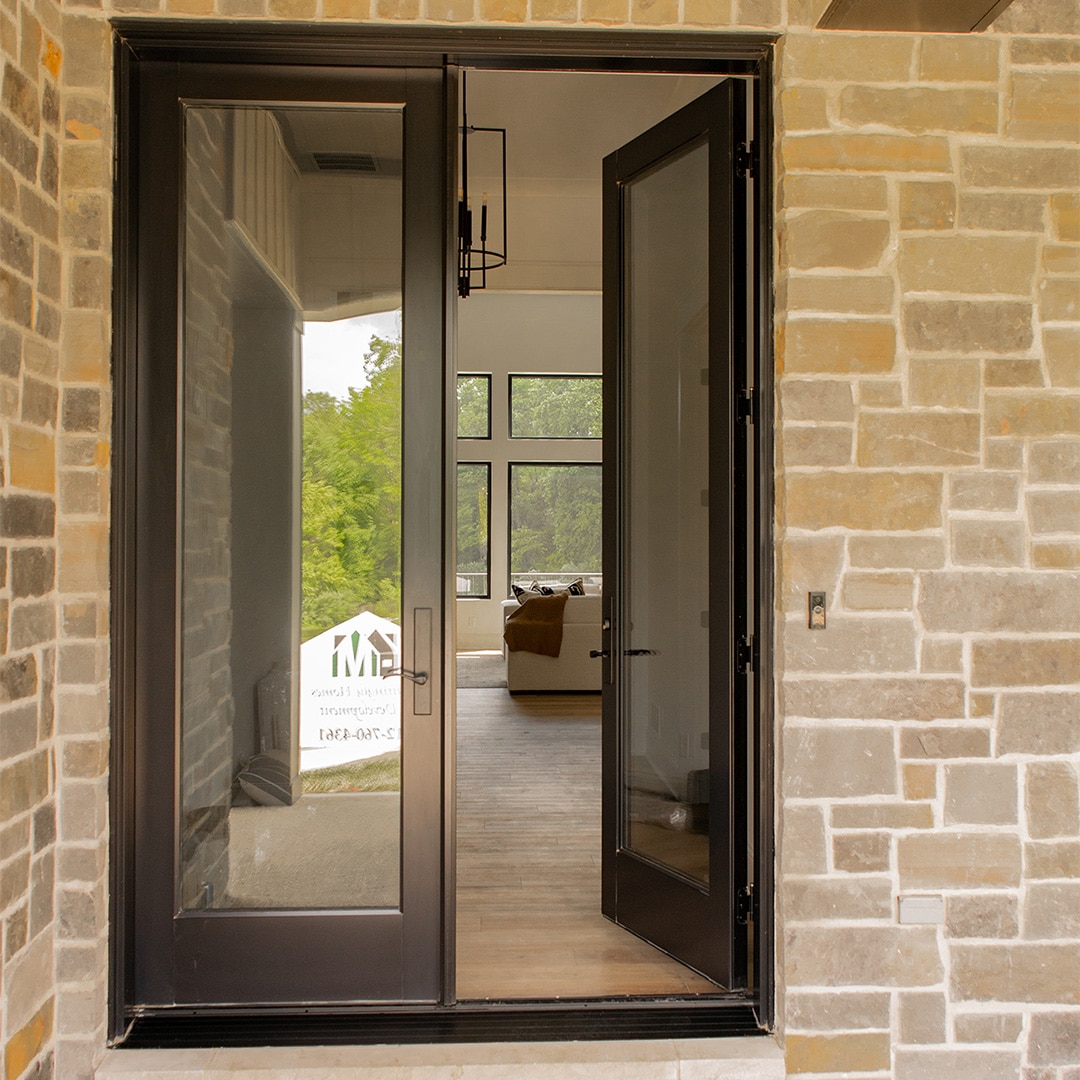 french doors with right door open into the home