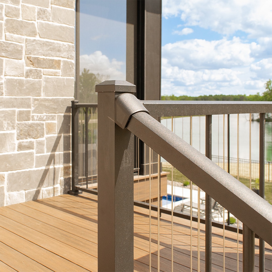 black aluminum handrail on backyard deck