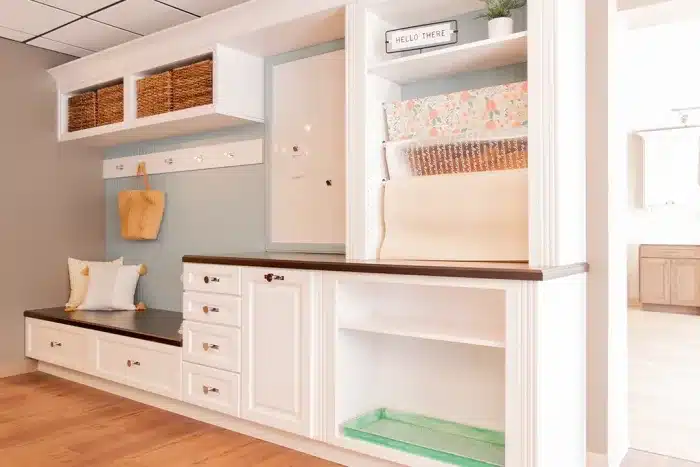 residential storage console with white cabinets and shelving