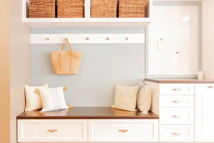 cabinet storage with bench seating and hanging hooks