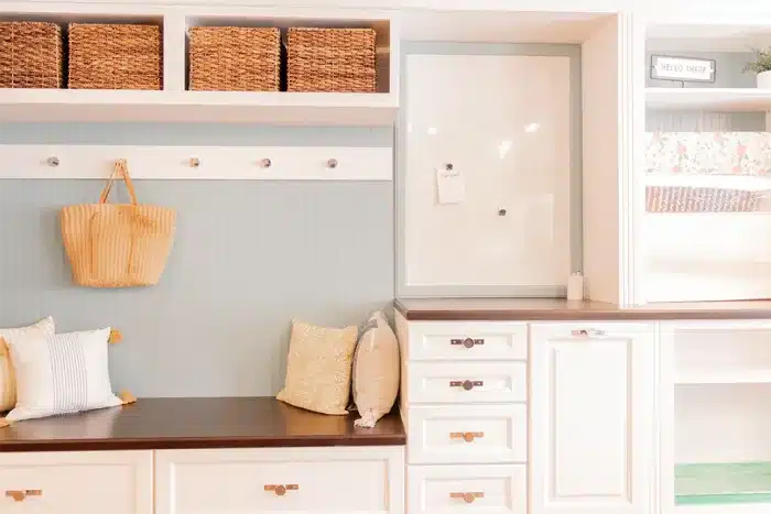 white cabinetry storage with bench seating