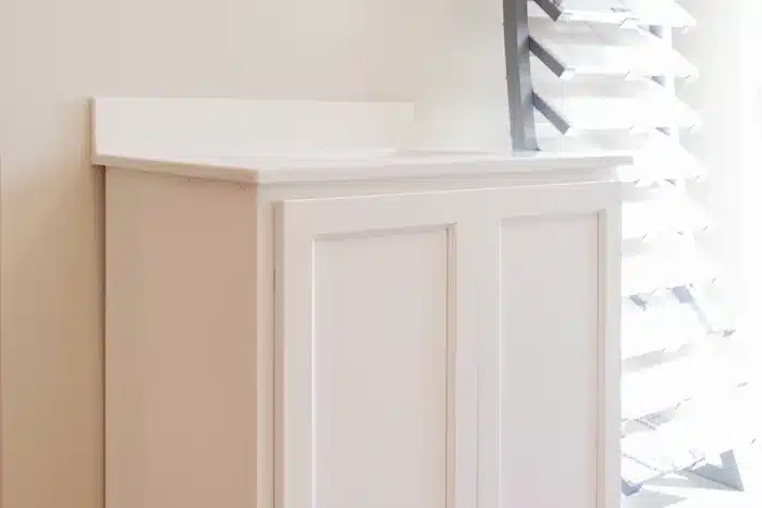 tall white bathroom vanity with quartz top