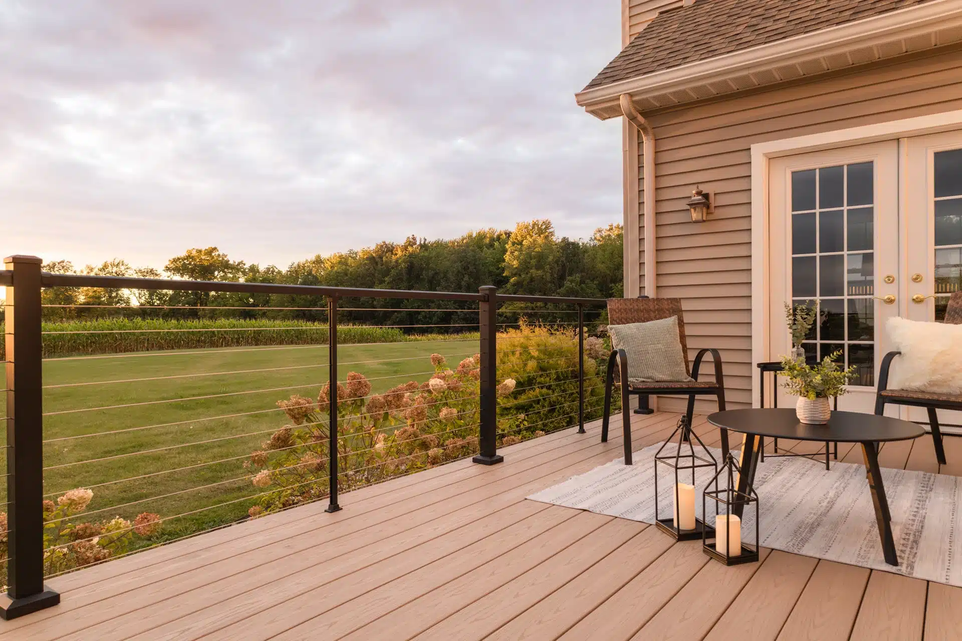 black horizontal cable railing on a backyard deck