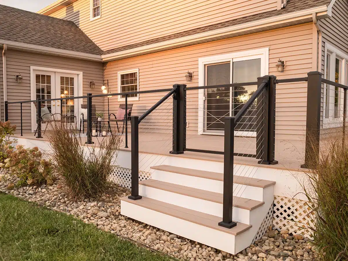 deck steps with horizontal cable railing and stair rails