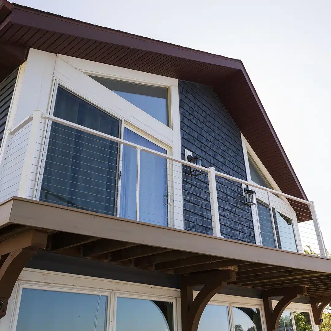 white railing on lake house