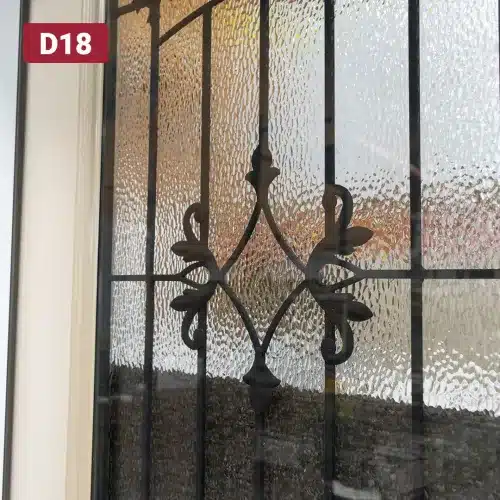 decorative wrought iron design in door glass