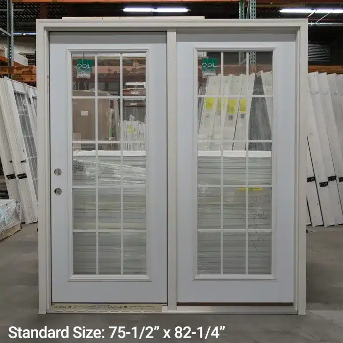 white patio steel patio doors standing inside warehouse