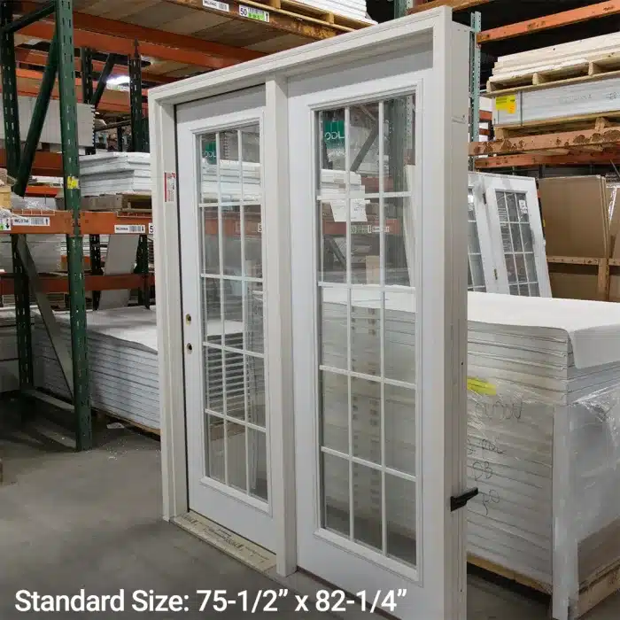 white patio steel patio doors standing inside warehouse