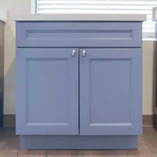 blue vanity cabinet with silver finishes and two doors