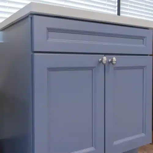 blue vanity cabinet with two butt doors