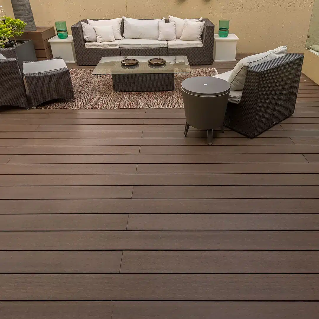 cozy backyard patio area with dark brown composite decking