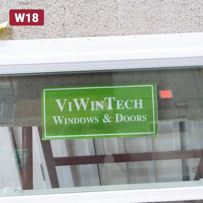 green viwintech manufacturer label on window glass pane