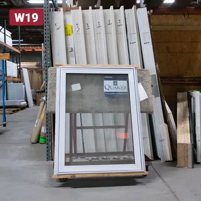 white casement window sitting on dolly