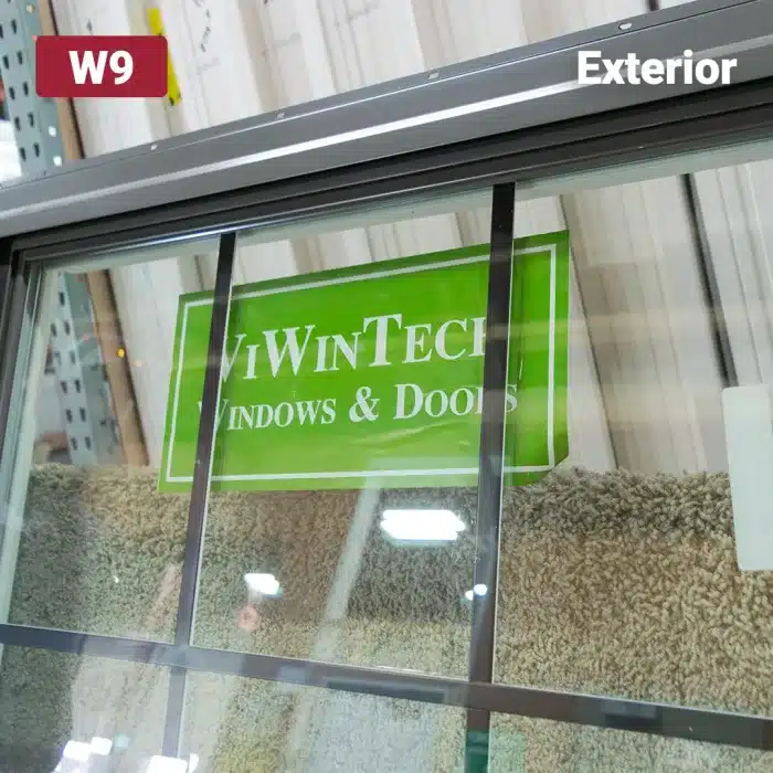 green viwintech sticker on glass window pane